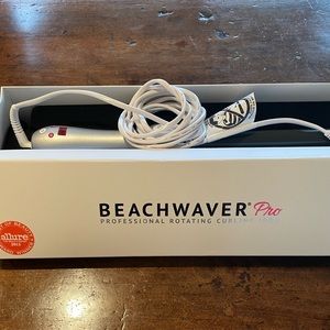 Beachwaver Pro rotating curling iron. Silver in original box.  Used twice.